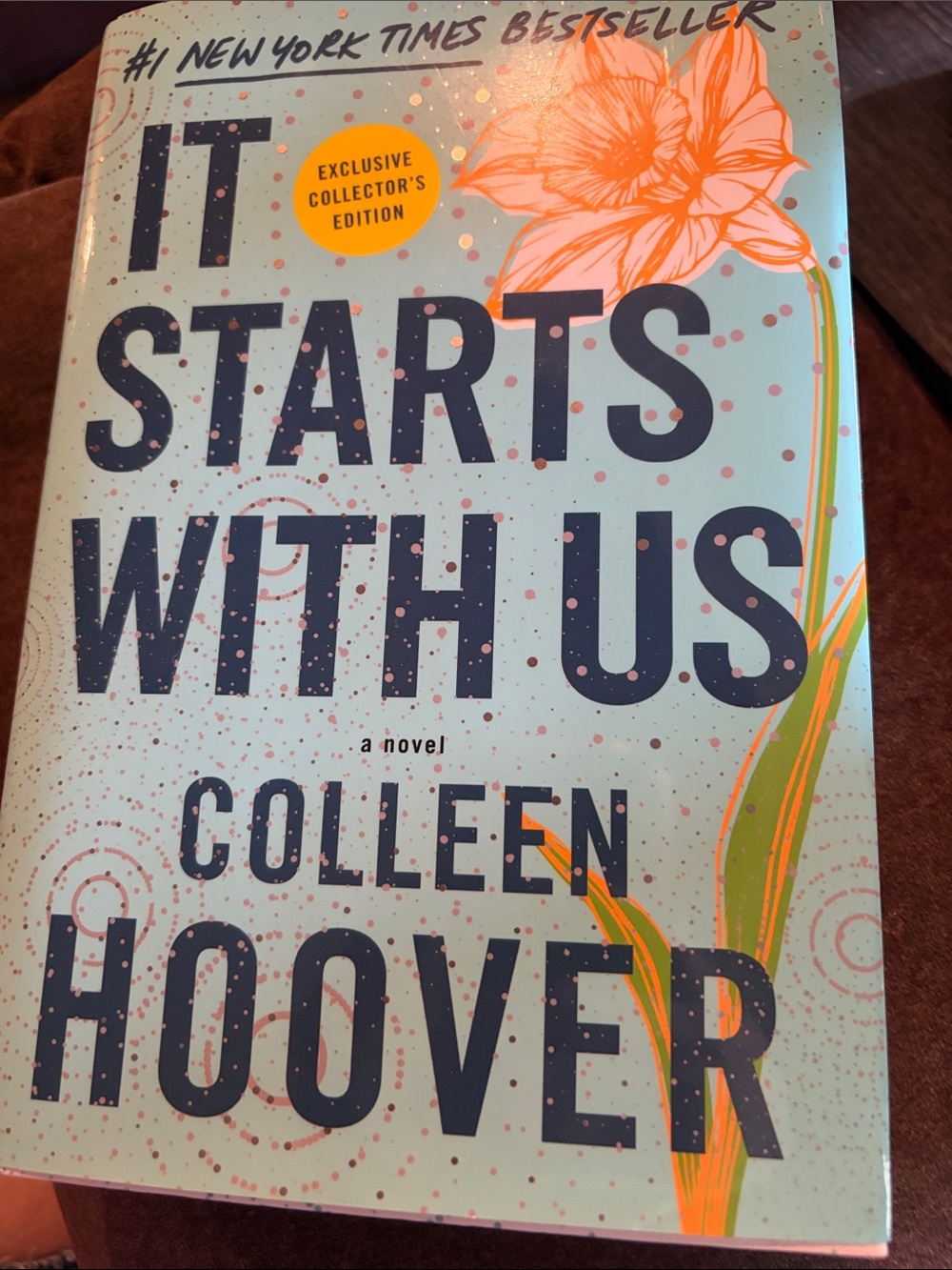 It Starts With Us — Light Teal Cover with Orange Floral Accents by